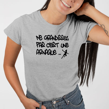 T-Shirt Femme Ne grandissez pas c'est une arnaque Gris